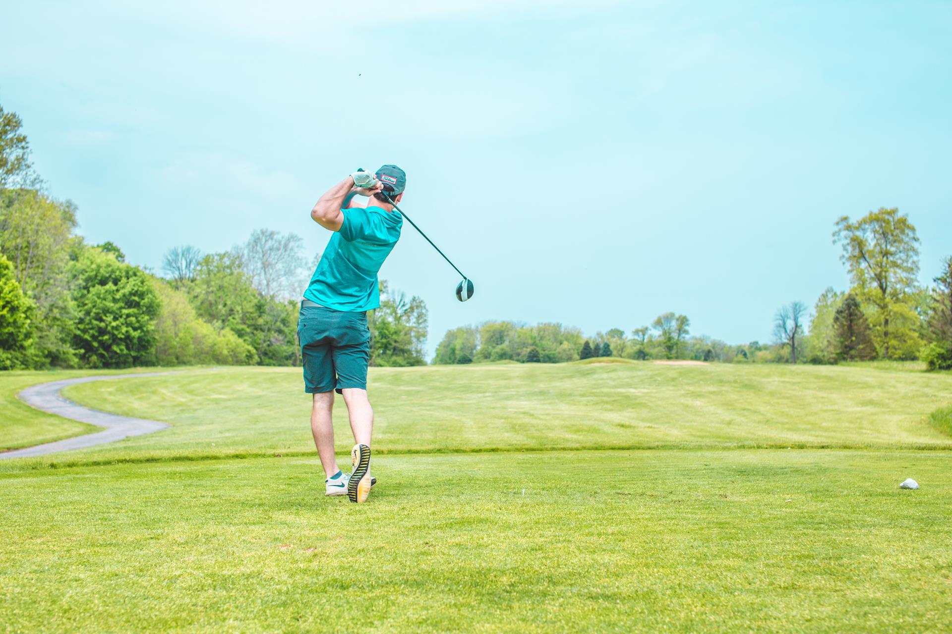 Man playing golf enjoying active lifestyle